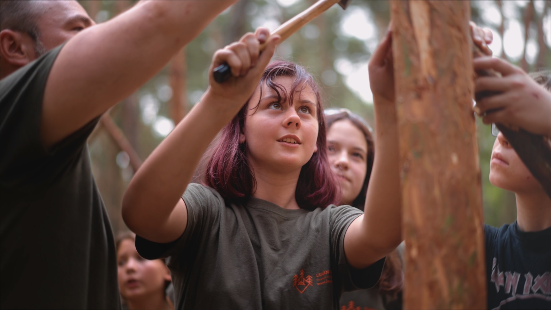 Girl learning to make fire